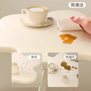 A few cream windblown hair and a few small coffee tables in the living room, a small dining table in the home, a small apartment