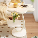 A few cream windblown hair and a few small coffee tables in the living room, a small dining table in the home, a small apartment